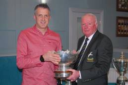 Michael McKenna receiving his Golfer of the Year trophy from 2021 Club Captain Mark Guinness